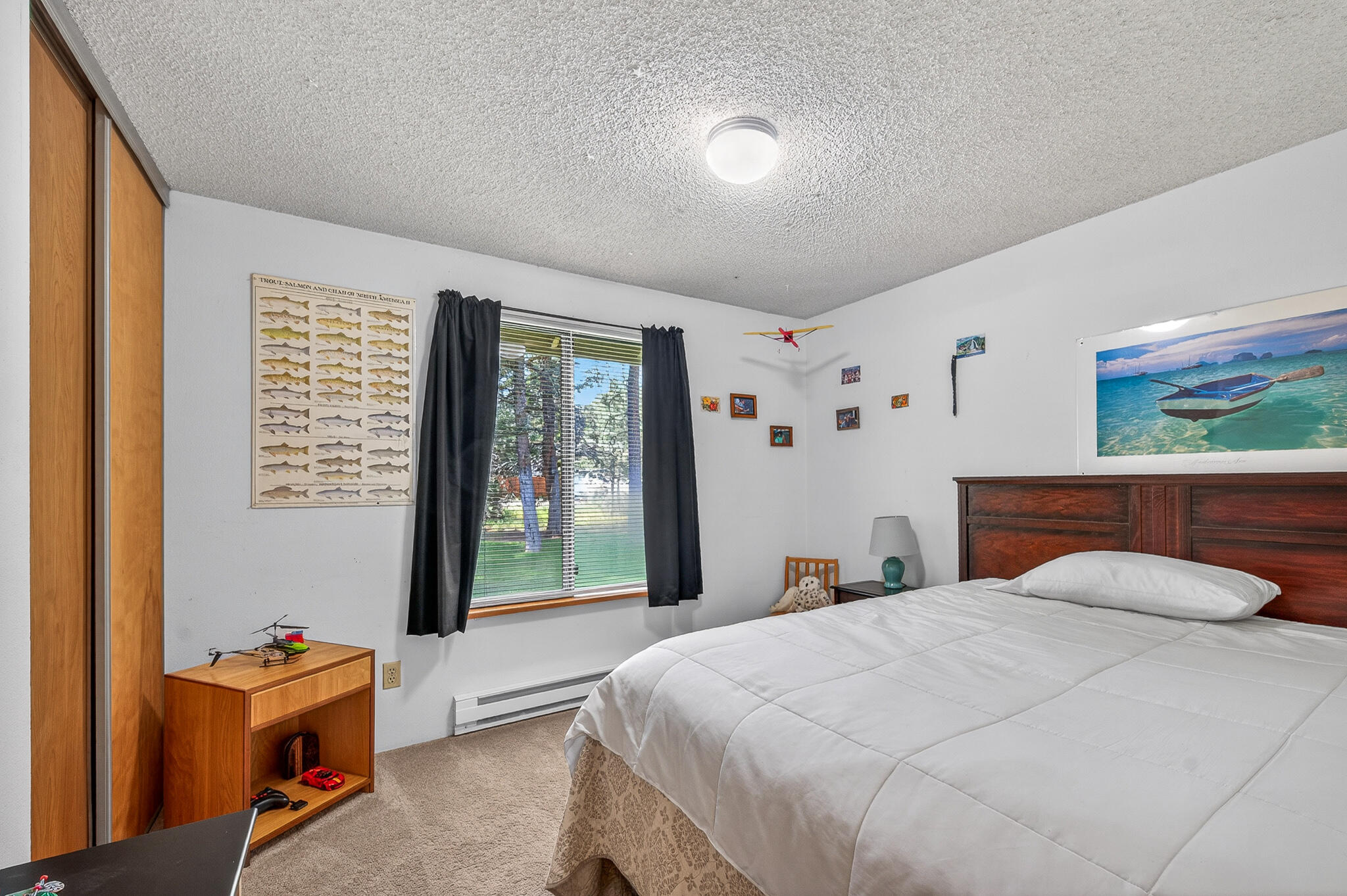 60866 Brosterhous Road Bend, OR 97702 - Photo 23 of 41 a bedroom with a bed and a large window