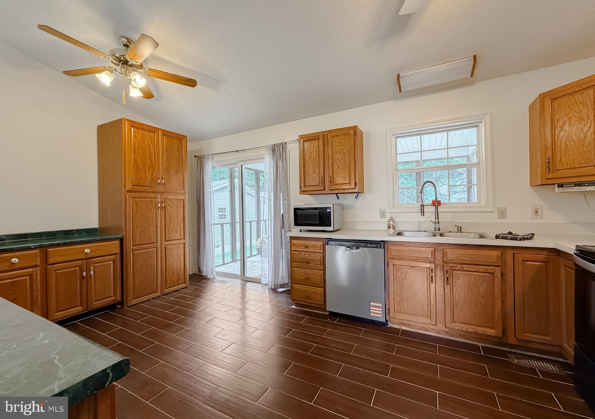 966 Crystal Rock Road Lusby, MD 20657 - Photo 12 of 49 walkout to the screened in deck