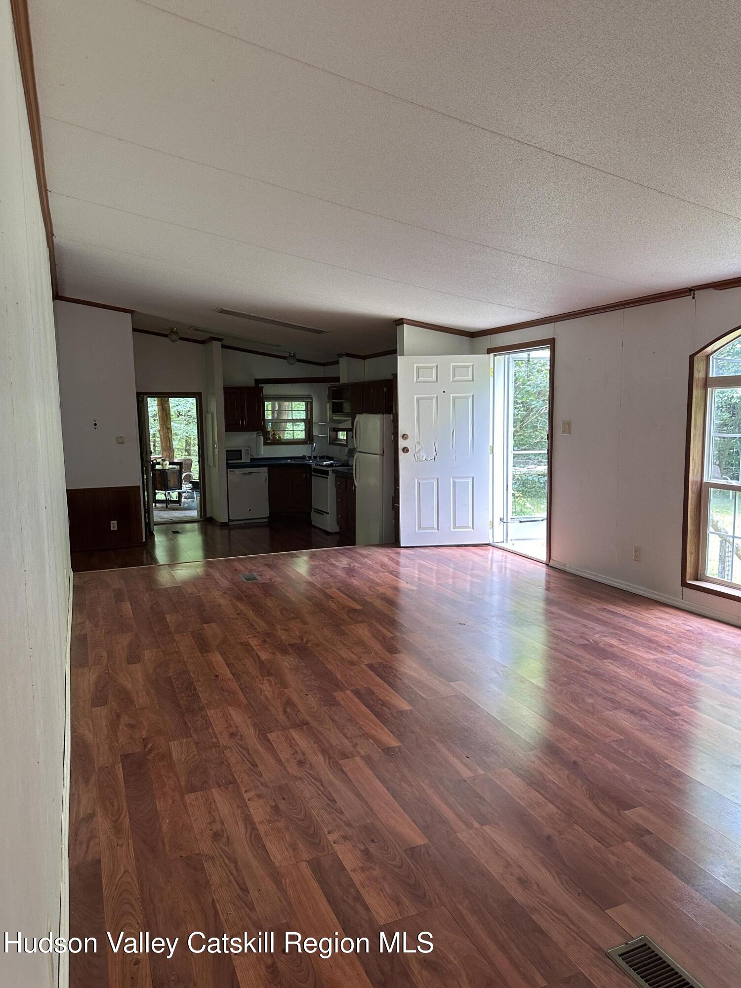166 Falls View Lane Purling, NY 12470 - Photo 15 of 26 wooden floor in an empty room with a window