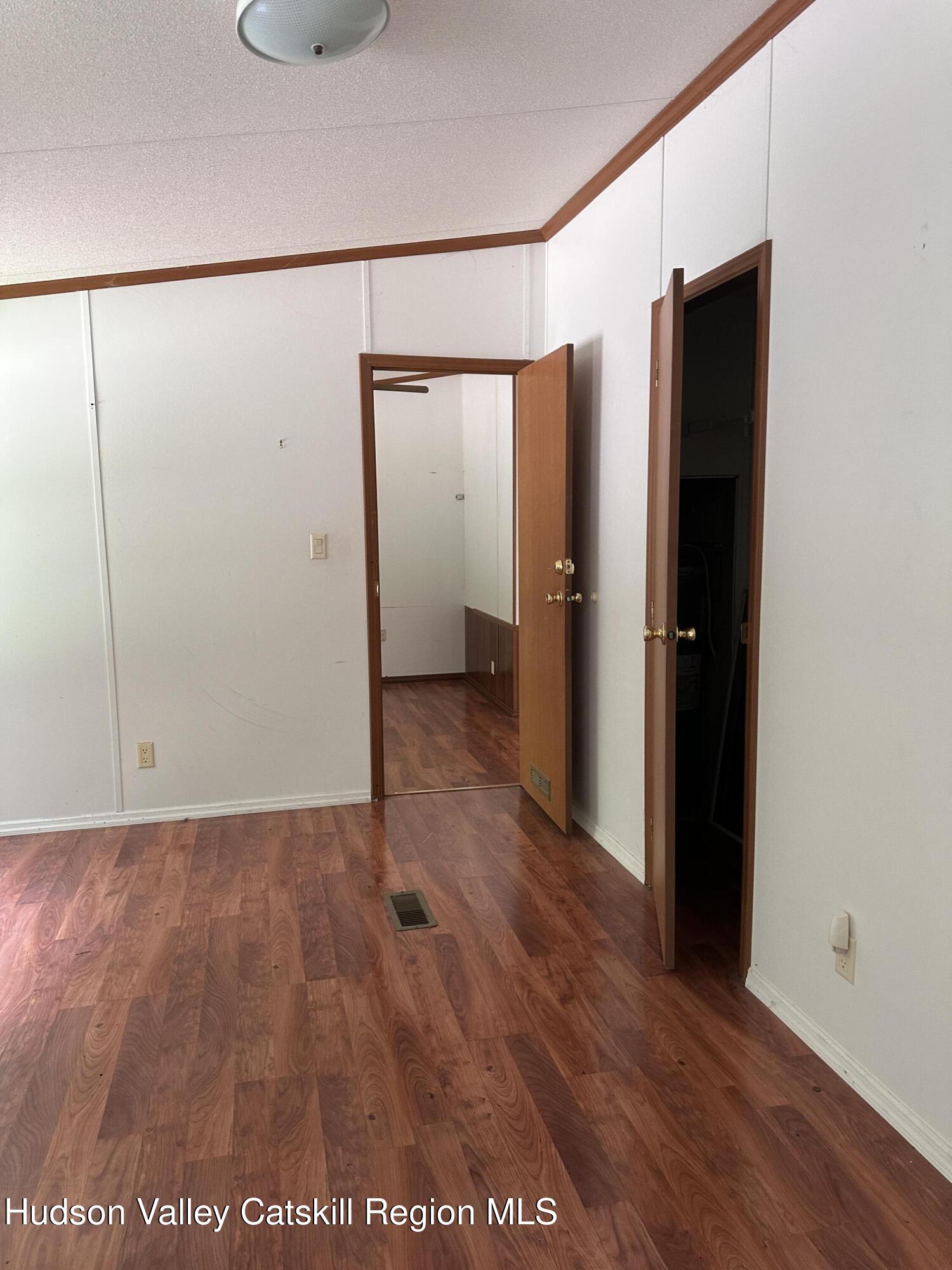 166 Falls View Lane Purling, NY 12470 - Photo 21 of 26 an empty room with wooden floor