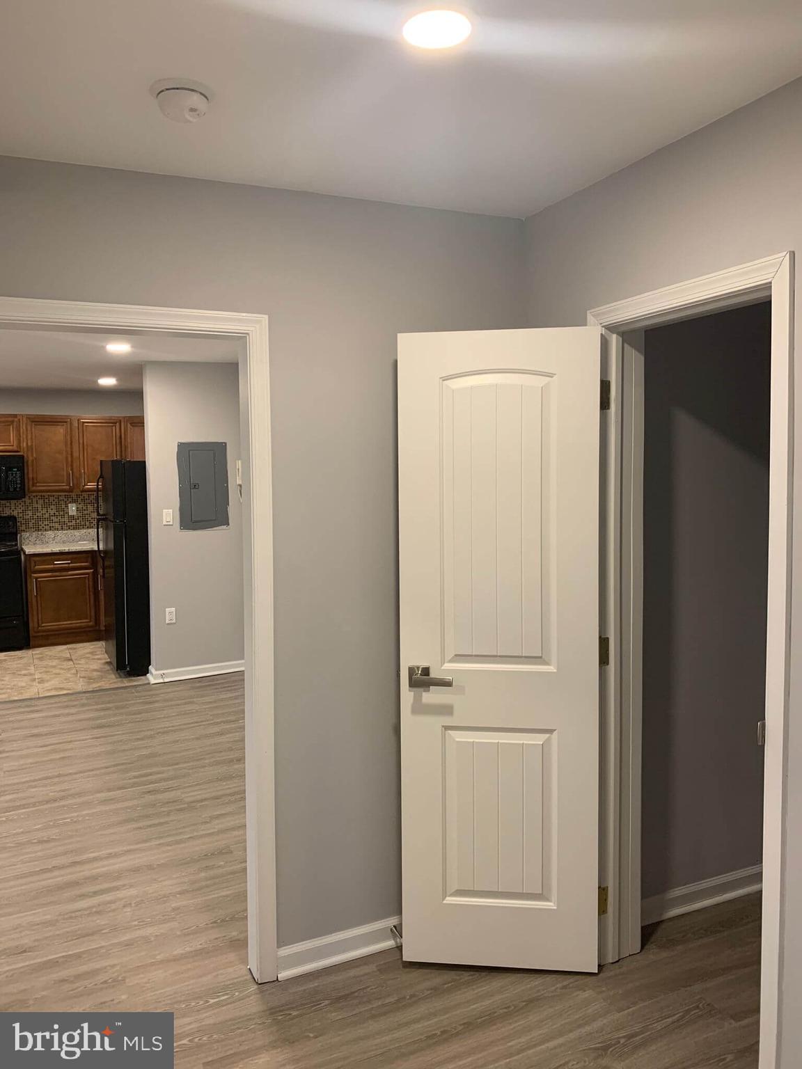 6001 North 17th Street, Unit 404 Philadelphia, PA 19141 - Photo 10 of 11 a view of a hallway with wooden floor
