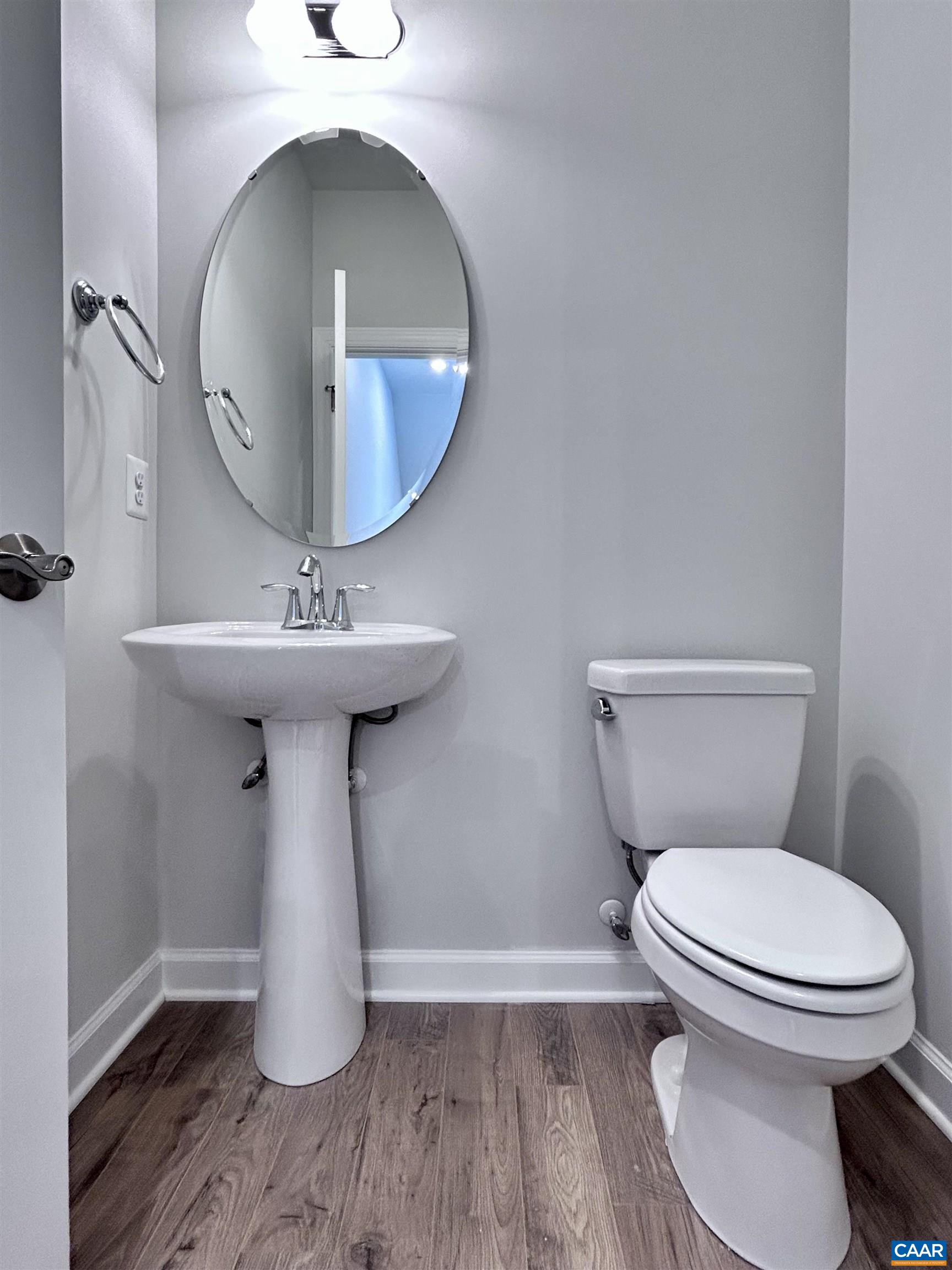 103 Keene Court Charlottesville, VA 22903 - Photo 18 of 18 a bathroom with a toilet sink and mirror