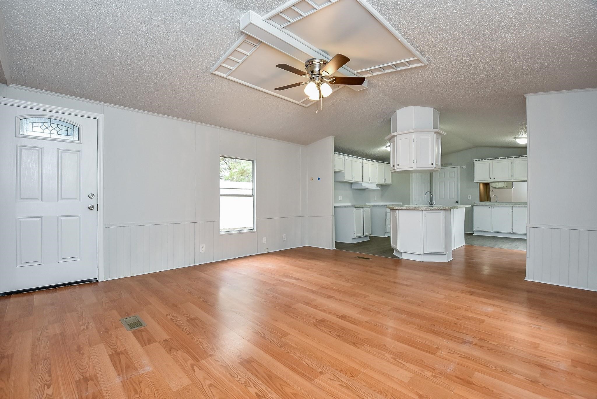 12842 Roy Harris Loop Conroe, TX 77306 - Photo 16 of 36 a view of a kitchen with a sink and a window