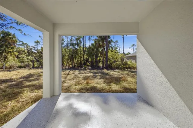 a view of a house with a yard and garage