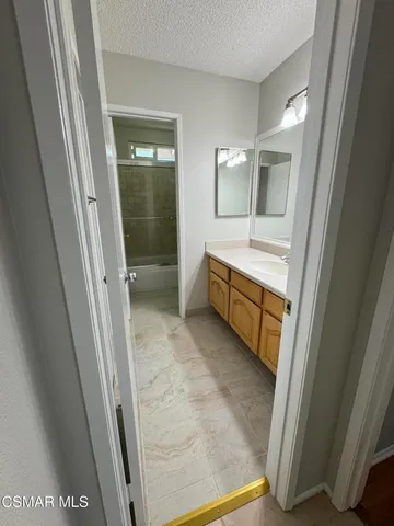 a bathroom with a shower and a toilet