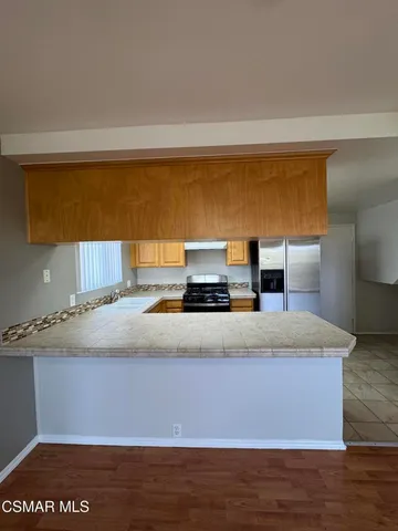 a bedroom with a bed and a night stand