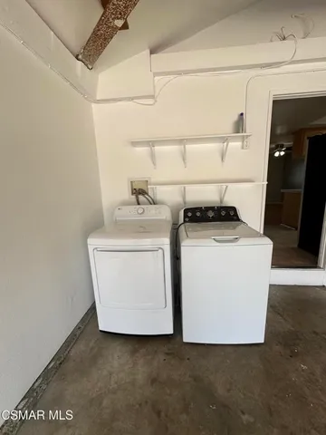 a utility room with washer and dryer