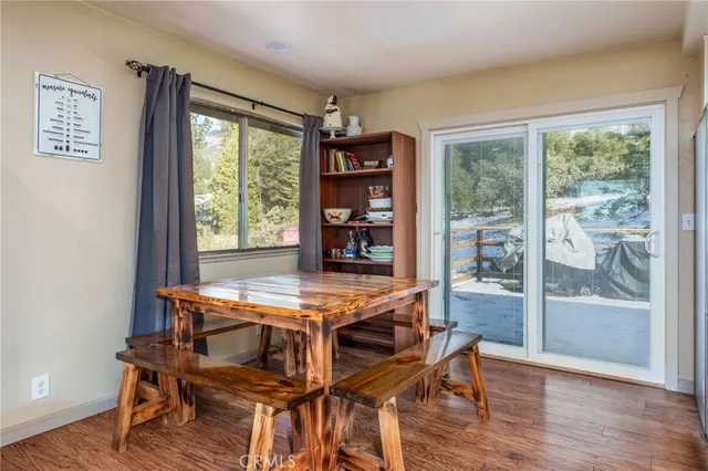 a kitchen with stainless steel appliances a refrigerator sink and cabinets