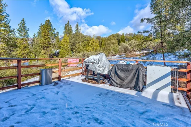 a view of a backyard with sitting area