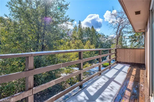 a view of balcony and yard