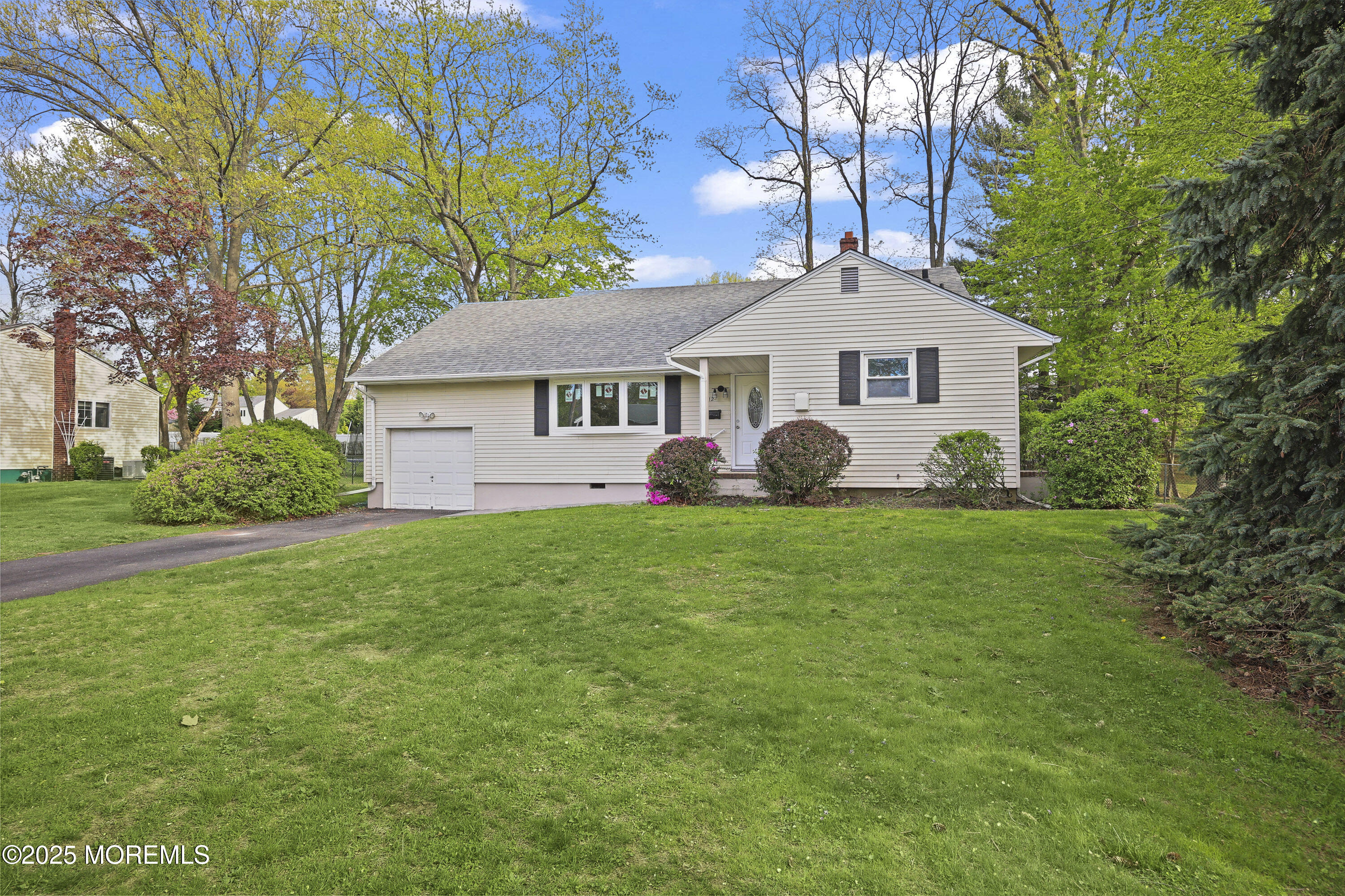 12 Mayfair Road Holmdel, NJ 07733 - Photo 3 of 38 a front view of a house with garden