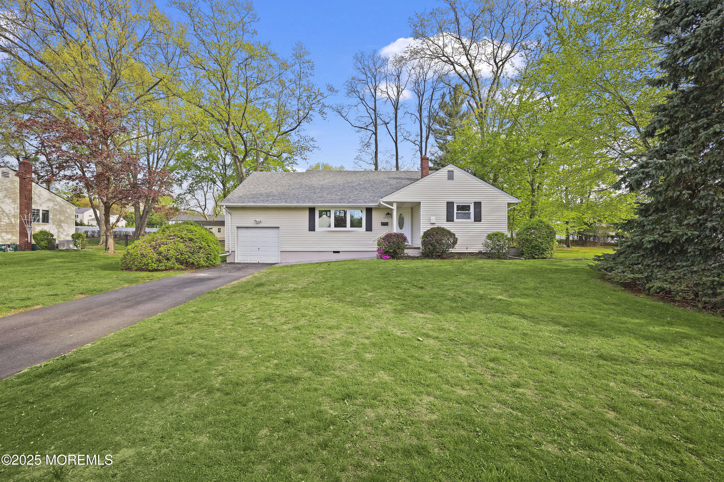 12 Mayfair Road Holmdel, NJ 07733 - Photo 34 of 38 a front view of a house with garden