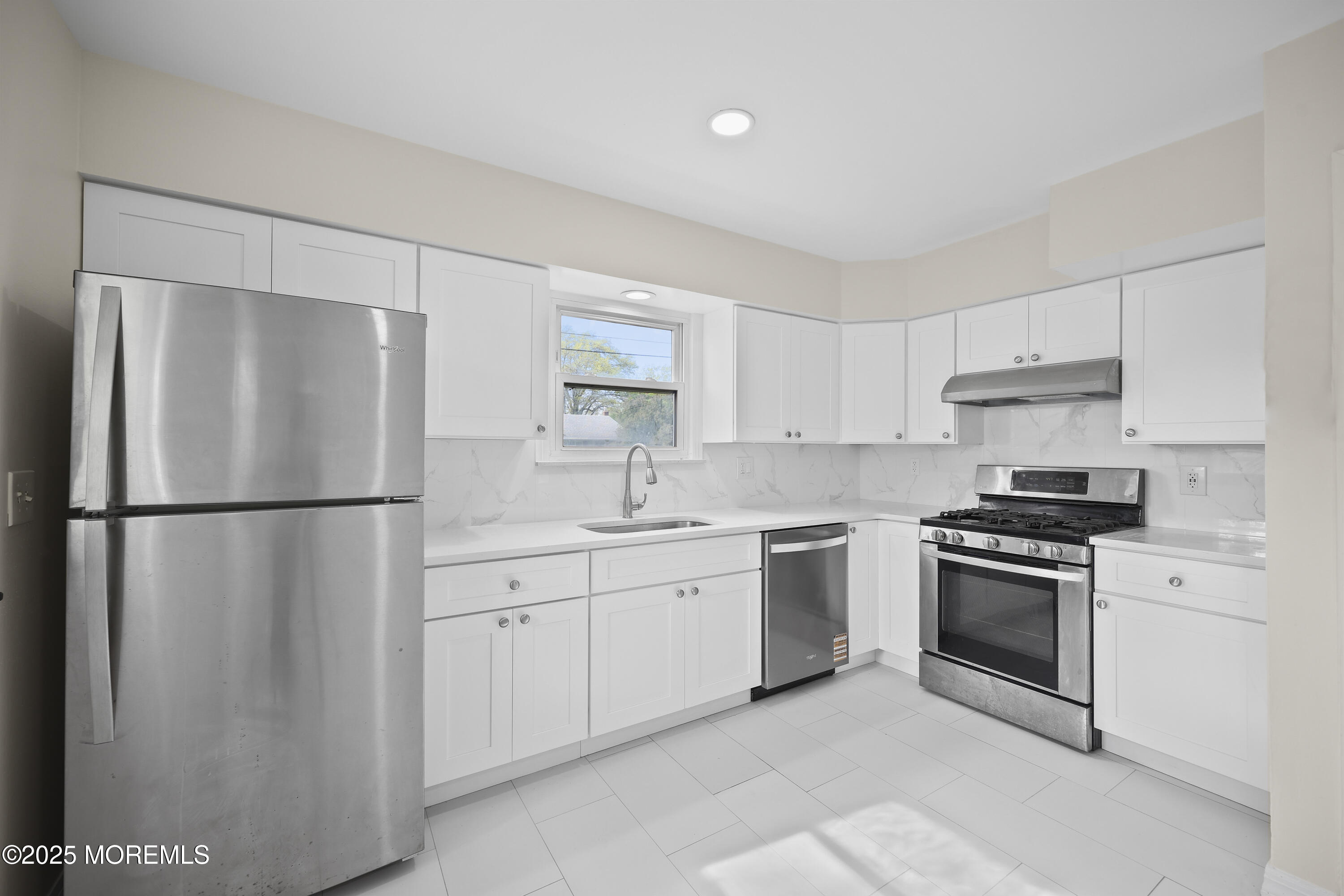 12 Mayfair Road Holmdel, NJ 07733 - Photo 10 of 38 a kitchen with stainless steel appliances a refrigerator sink and cabinets