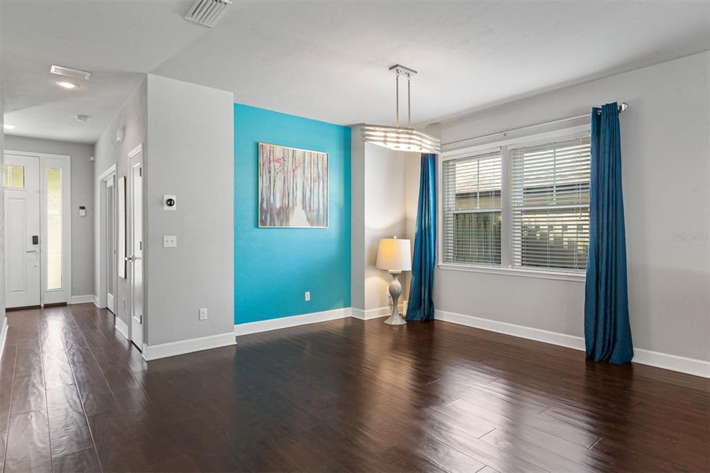 4855 Southwest 64th Road Gainesville, FL 32608 - Photo 11 of 44 an empty room with wooden floor and a window