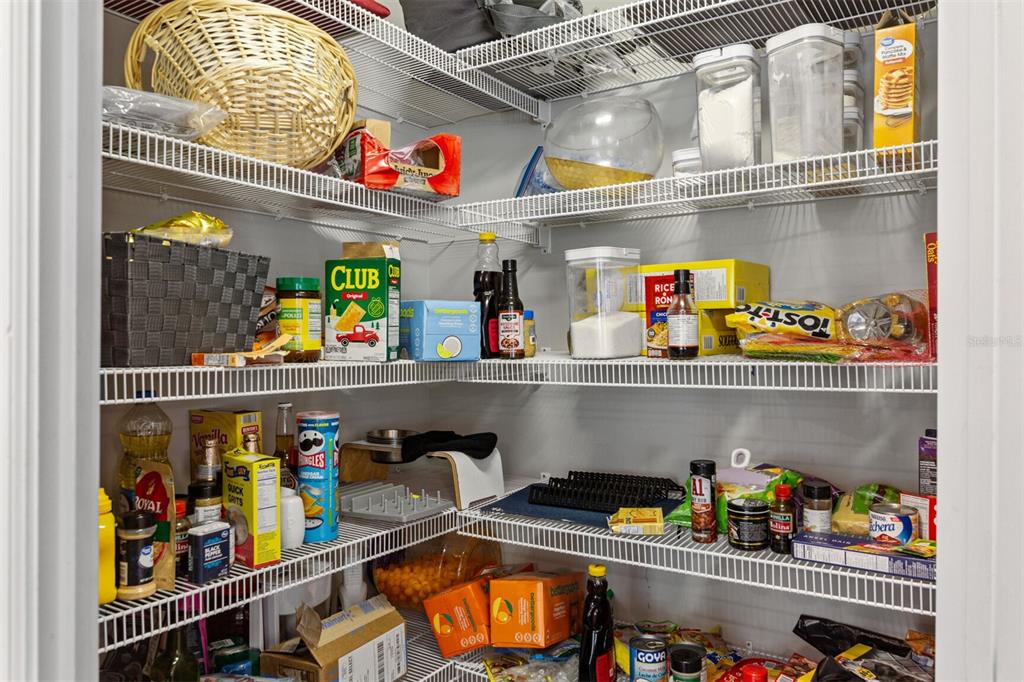 4855 Southwest 64th Road Gainesville, FL 32608 - Photo 20 of 44 a store room with granite countertop lots of different kinds of food