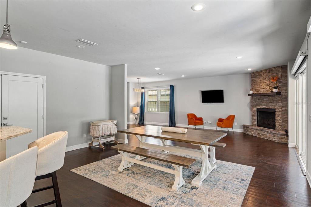 4855 Southwest 64th Road Gainesville, FL 32608 - Photo 22 of 44 a living room with furniture and a wooden floor