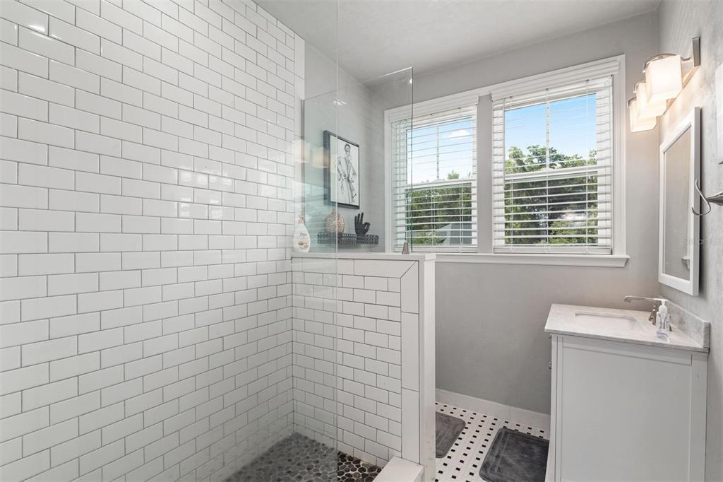 4855 Southwest 64th Road Gainesville, FL 32608 - Photo 25 of 44 a bathroom with a sink a toilet and window