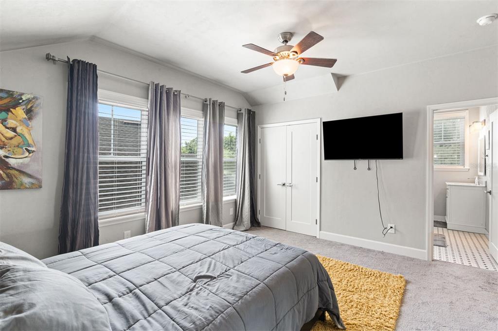 4855 Southwest 64th Road Gainesville, FL 32608 - Photo 29 of 44 a bedroom with a bed and a flat screen tv