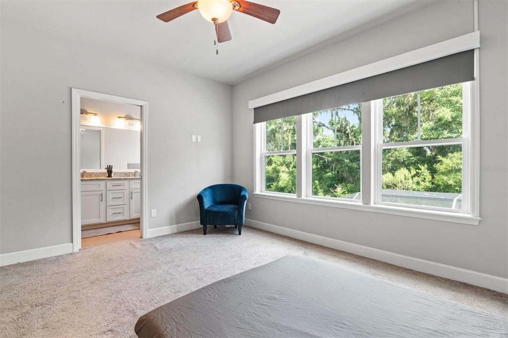 4855 Southwest 64th Road Gainesville, FL 32608 - Photo 30 of 44 a living room with furniture and a large window