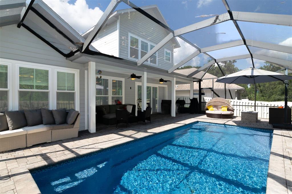 4855 Southwest 64th Road Gainesville, FL 32608 - Photo 38 of 44 a living room with furniture and a fireplace