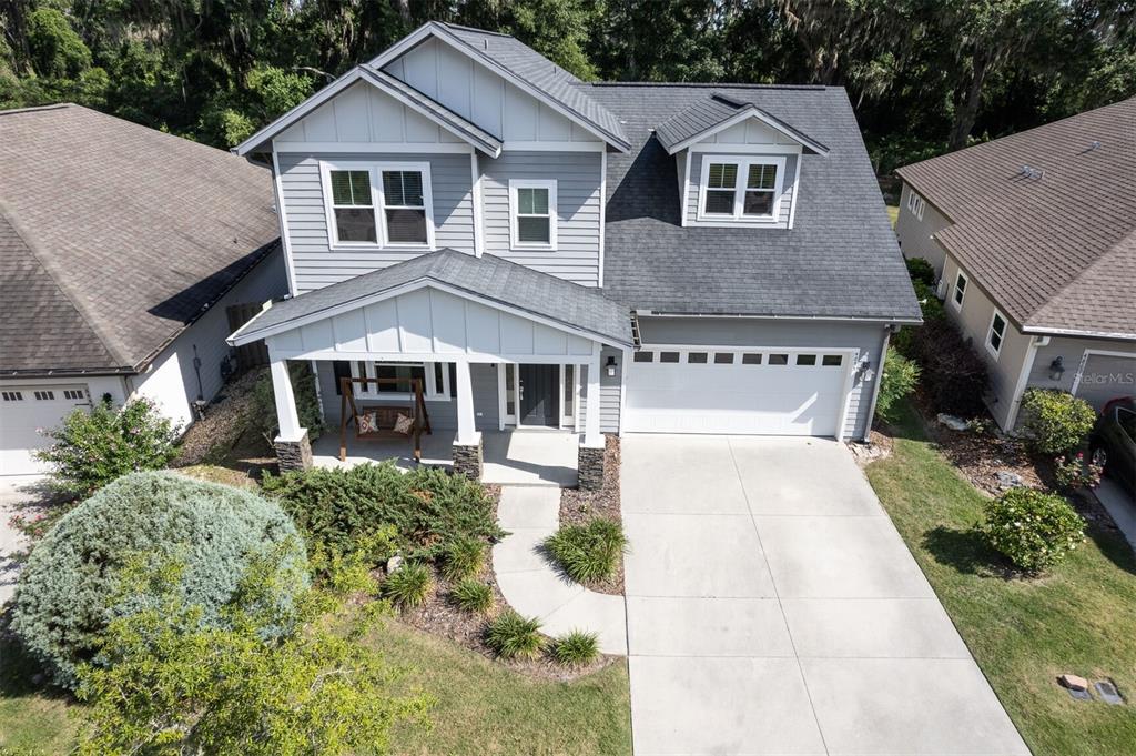 4855 Southwest 64th Road Gainesville, FL 32608 - Photo 44 of 44 a front view of a house with yard and green space
