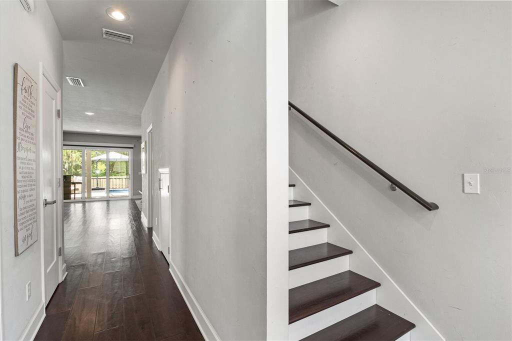 4855 Southwest 64th Road Gainesville, FL 32608 - Photo 6 of 44 a view of entryway and hall with wooden floor