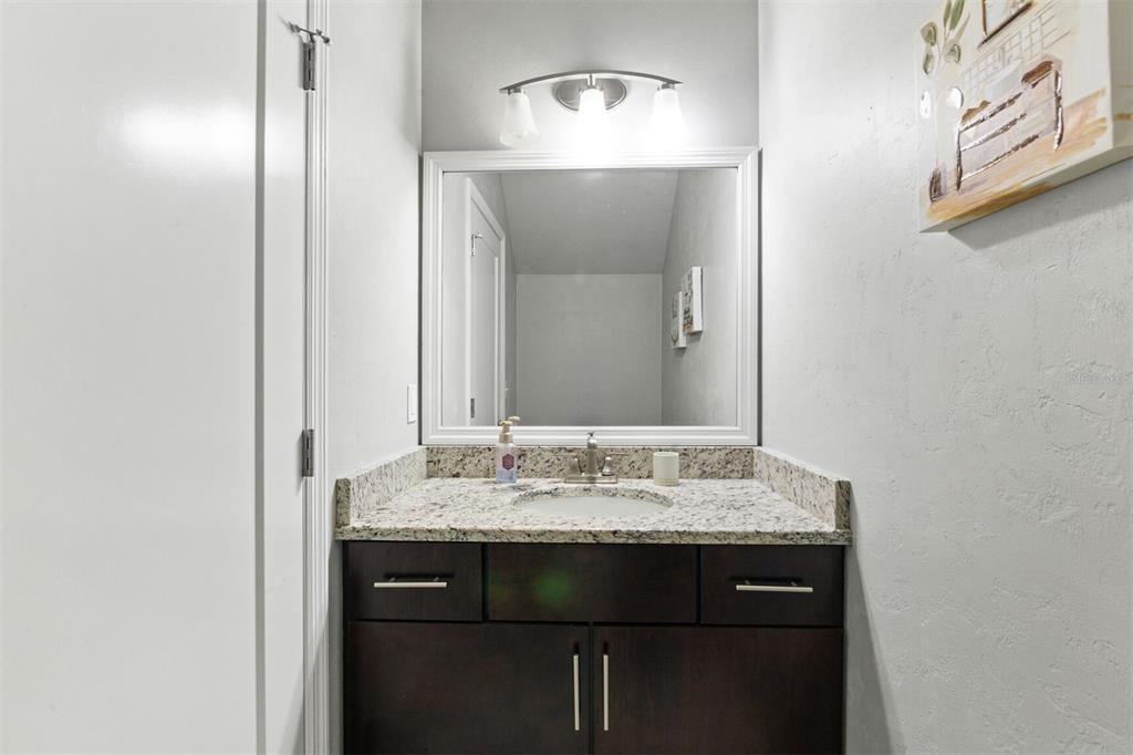 4855 Southwest 64th Road Gainesville, FL 32608 - Photo 9 of 44 a bathroom with a sink and a mirror