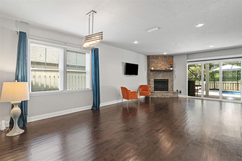 4855 Southwest 64th Road Gainesville, FL 32608 - Photo 10 of 44 a view of livingroom with furniture wooden floor and windows
