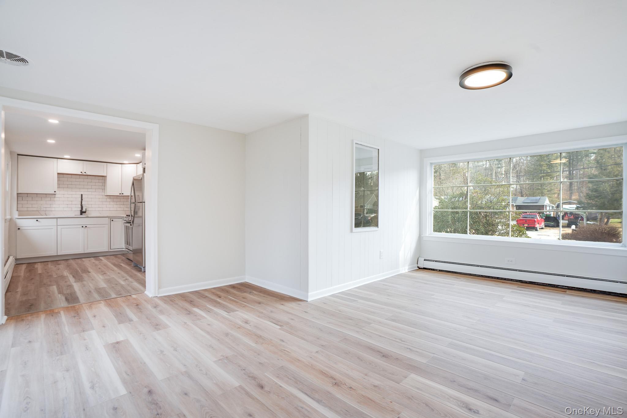 3 Pond Road Hyde Park, NY 12601 - Photo 13 of 34 a view of a room with wooden floor and windows