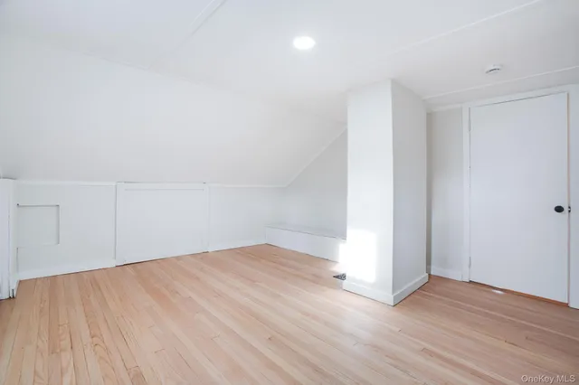 an empty room with wooden floor
