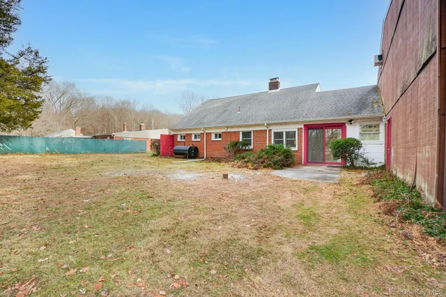 a view of yard with large trees