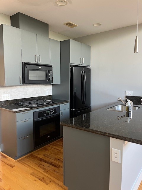 1045 Bonner Street Houston, TX 77007 - Photo 13 of 17 a kitchen with granite countertop a stove and a refrigerator