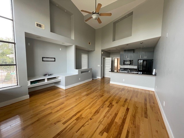 1045 Bonner Street Houston, TX 77007 - Photo 10 of 17 a view of kitchen and hall with wooden floor