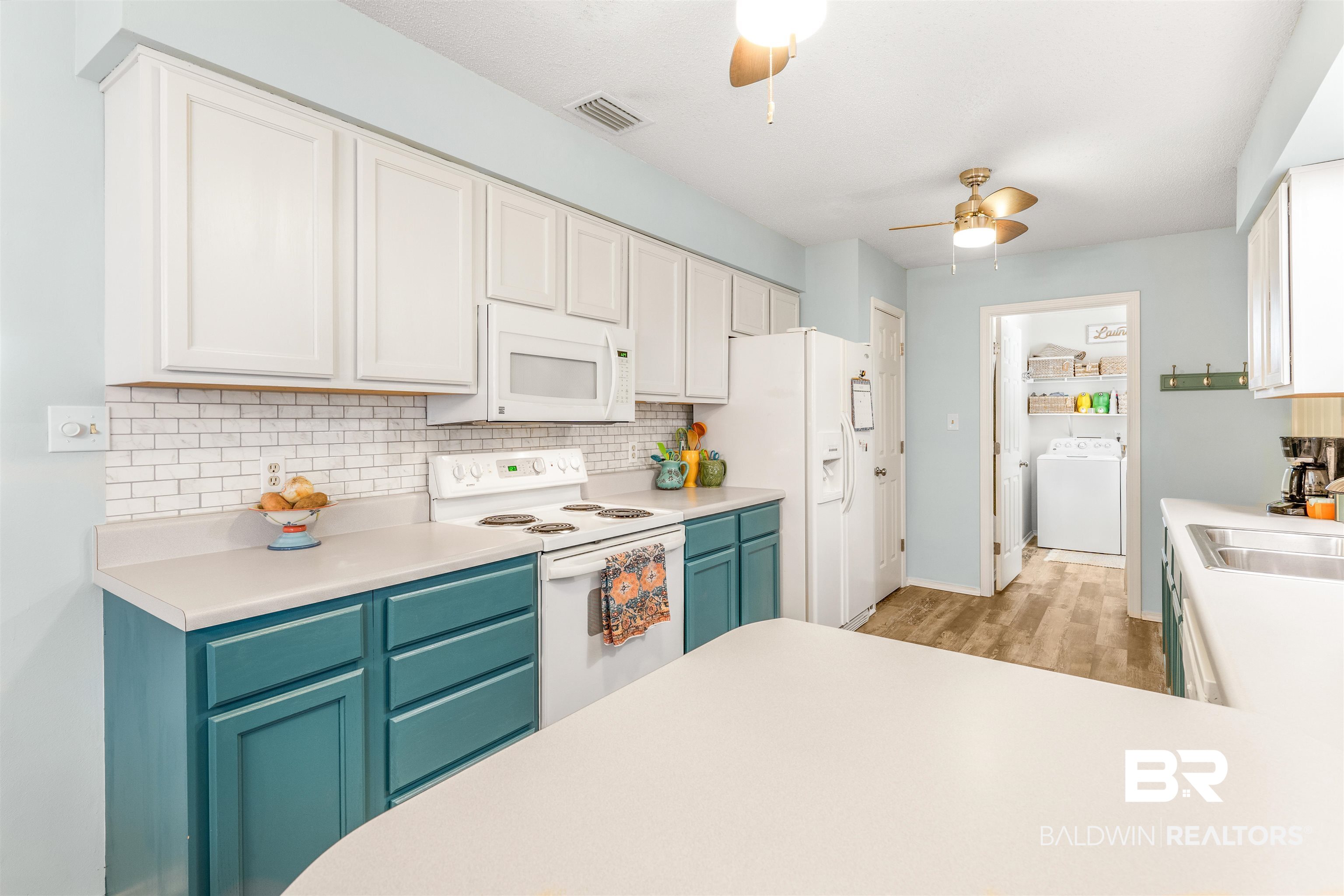 518 Ariel Avenue Foley, AL 36535 - Photo 14 of 47 Kitchen featuring light wood-type flooring, white appliances, white cabinetry, and ceiling fan