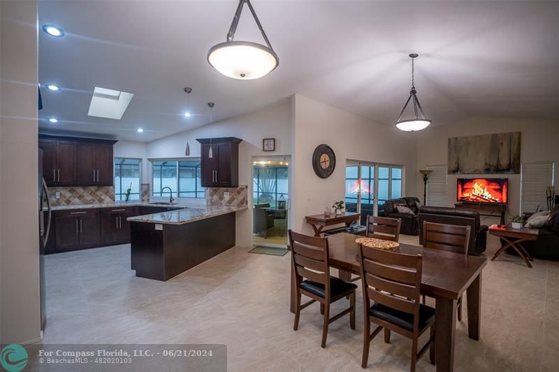 1224 Northwest 15th Street Boca Raton, FL 33486 - Photo 6 of 20 a living room with dining room furniture and a flat screen tv
