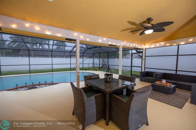 1224 Northwest 15th Street Boca Raton, FL 33486 - Photo 8 of 20 a roof deck with table and chairs