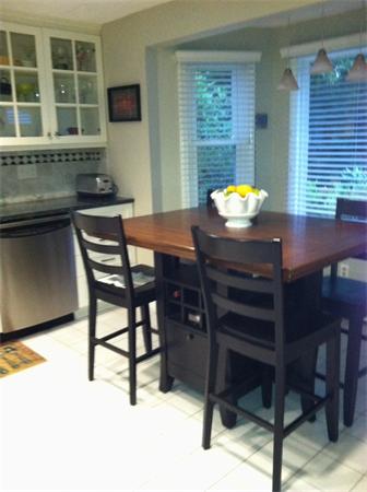 129 Hampton Road Sharon, MA 02067 - Photo 3 of 10 a kitchen with a table chairs and a window