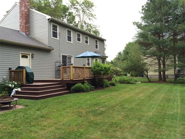 129 Hampton Road Sharon, MA 02067 - Photo 5 of 10 a front view of a house with a yard