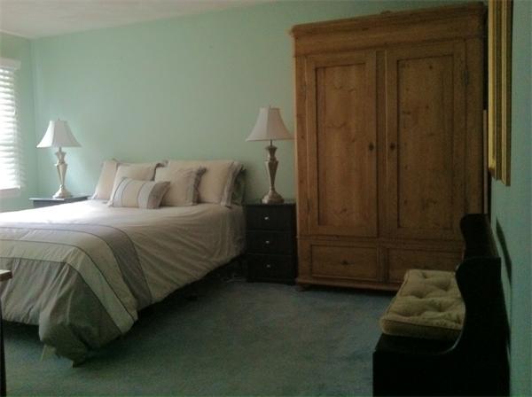 129 Hampton Road Sharon, MA 02067 - Photo 6 of 10 a bedroom with a bed and a night stand