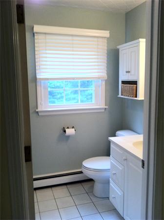 129 Hampton Road Sharon, MA 02067 - Photo 9 of 10 a bathroom with a toilet a sink and a window