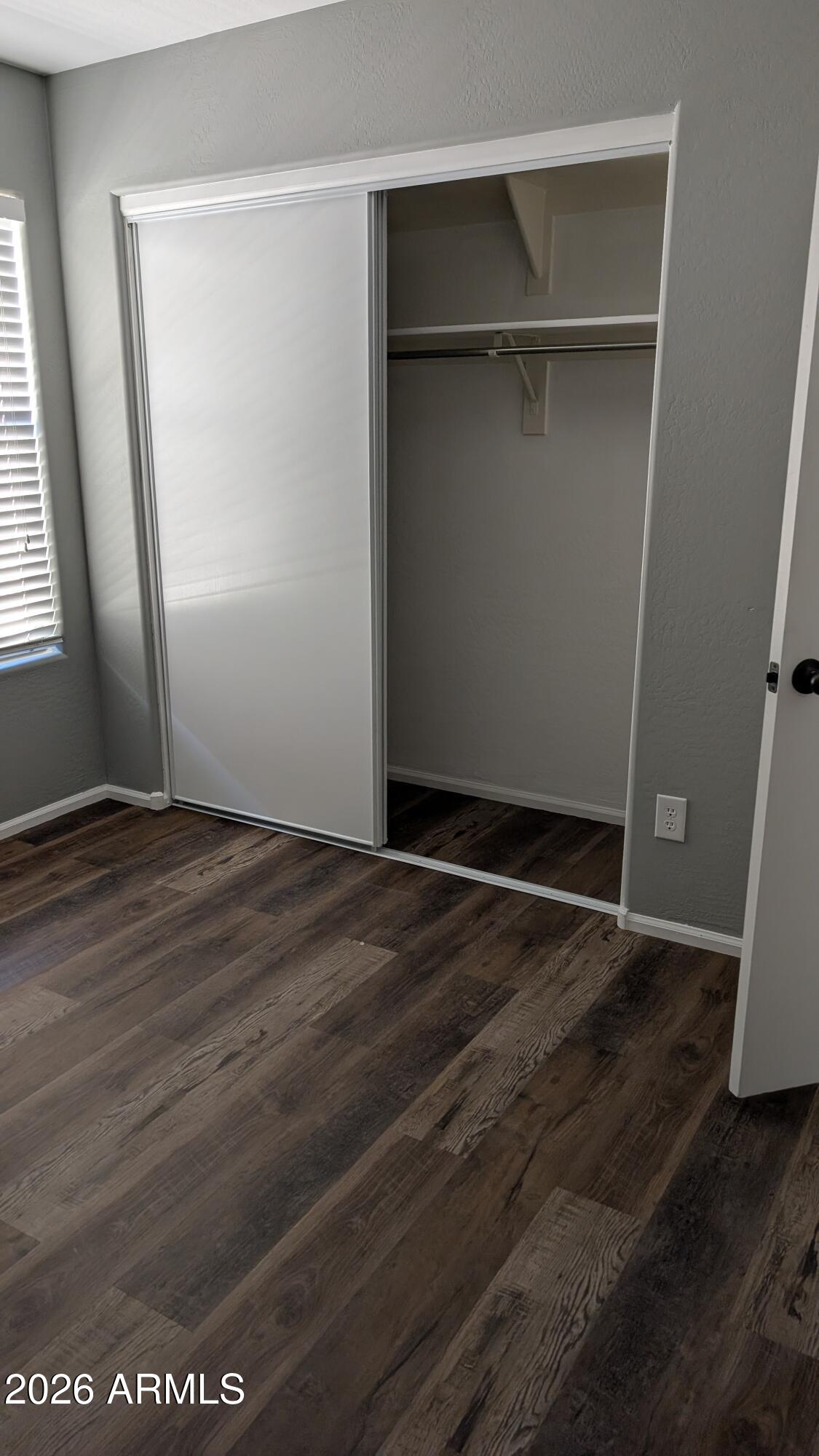 1377 East Pryor Road San Tan Valley, AZ 85140 - Photo 27 of 31 an empty room with wooden floor and closet