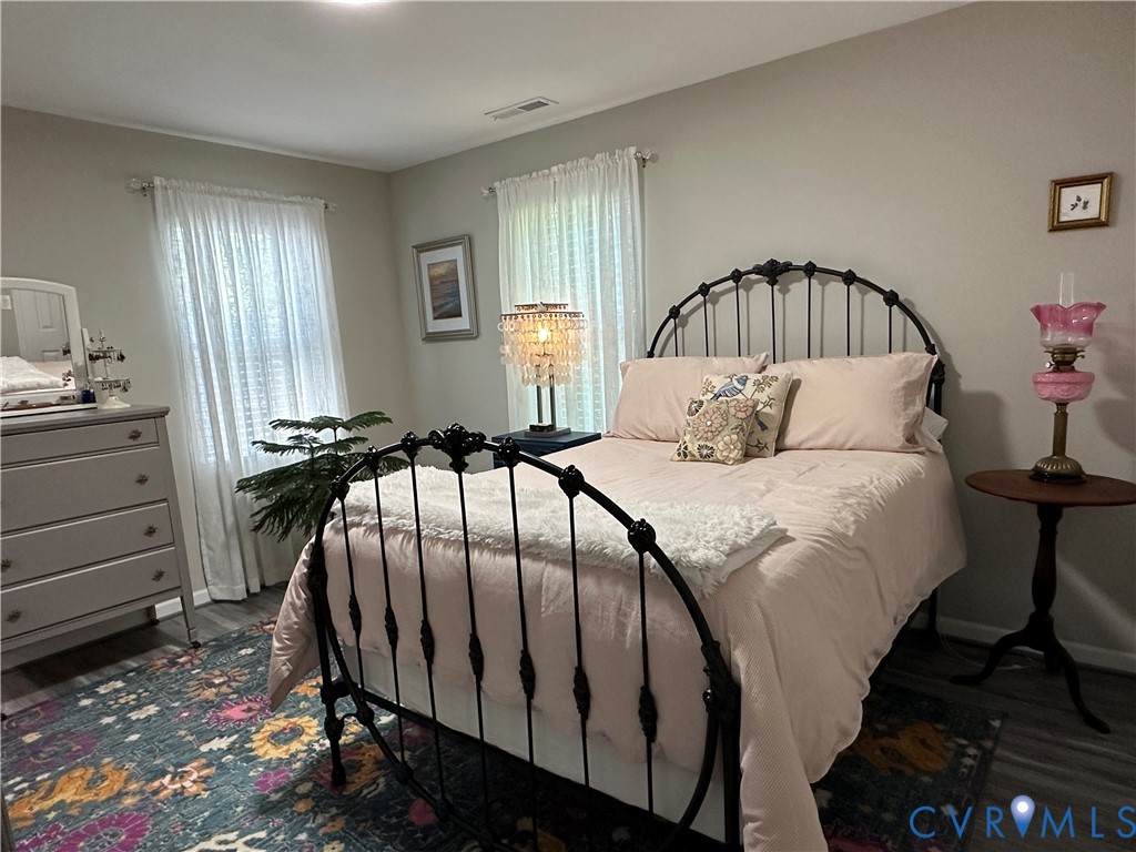 305 Myrtle Street, Unit A Ashland, VA 23005 - Photo 19 of 59 a bedroom with a bed and a window