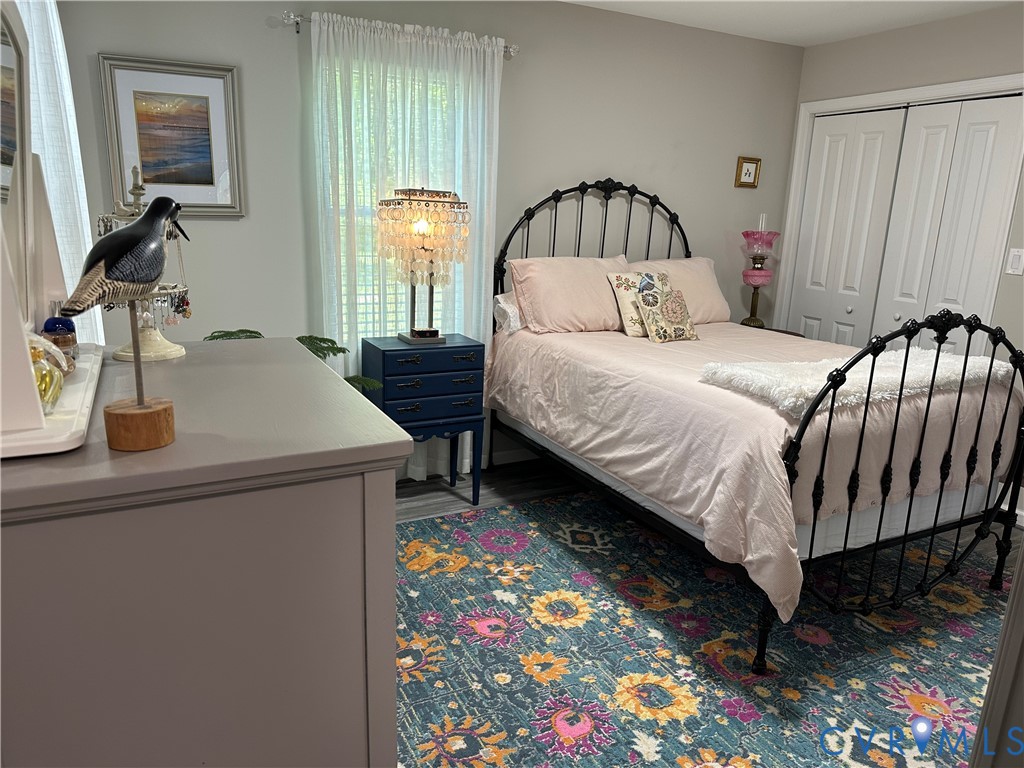 305 Myrtle Street, Unit A Ashland, VA 23005 - Photo 20 of 59 a bedroom with a bed and a dresser