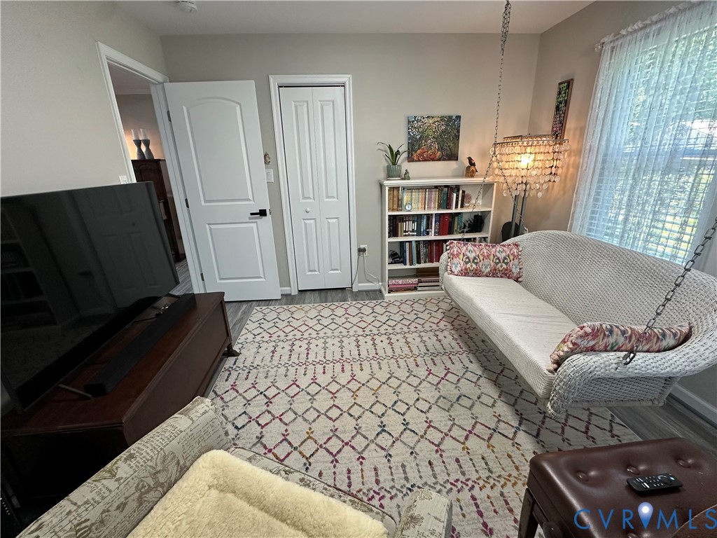 305 Myrtle Street, Unit A Ashland, VA 23005 - Photo 28 of 59 a living room with furniture and wooden floor