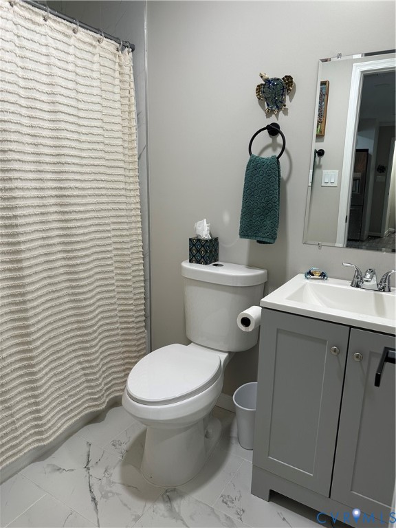 305 Myrtle Street, Unit A Ashland, VA 23005 - Photo 32 of 59 a bathroom with a sink toilet and shower