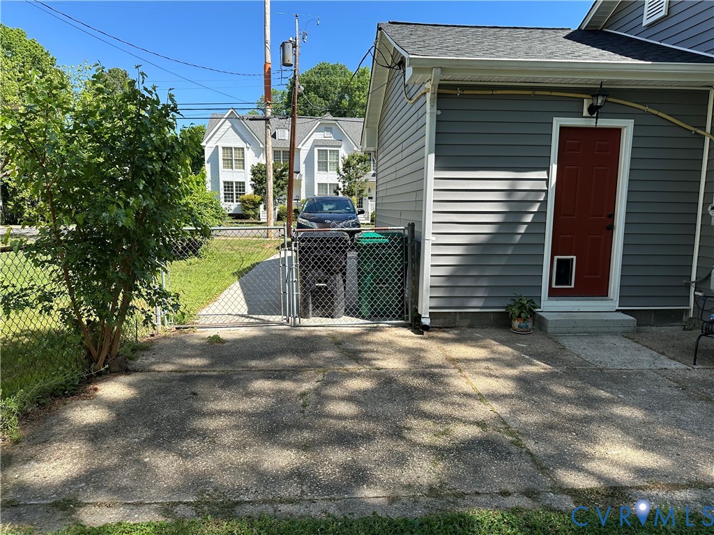 305 Myrtle Street, Unit A Ashland, VA 23005 - Photo 49 of 59 a view of a house with a yard and garage
