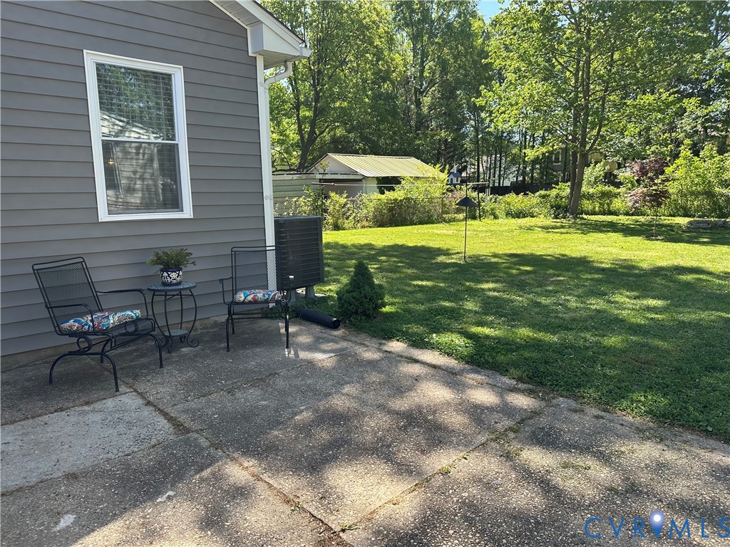 305 Myrtle Street, Unit A Ashland, VA 23005 - Photo 52 of 59 a view of a house with backyard and sitting area
