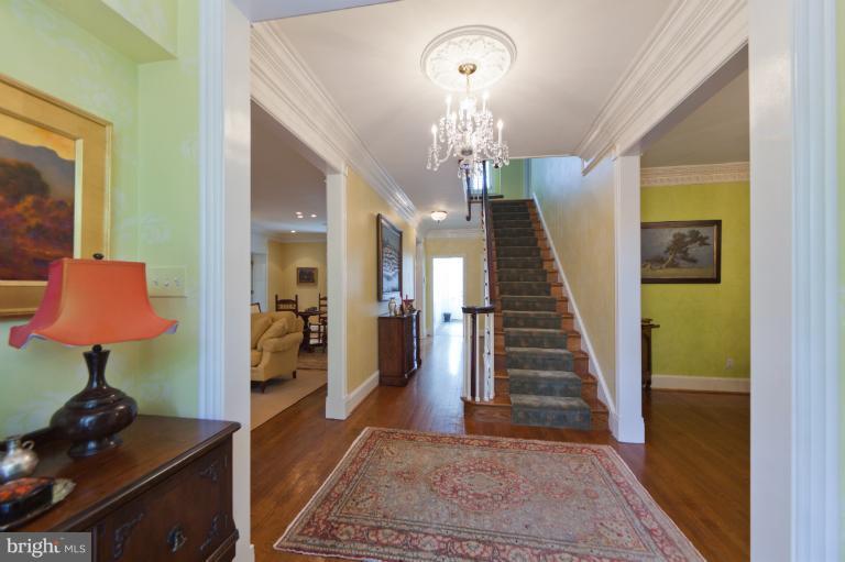 2012 South Arlington Ridge Road Arlington, VA 22202 - Photo 11 of 30 a view of a hallway to a livingroom and a chandelier