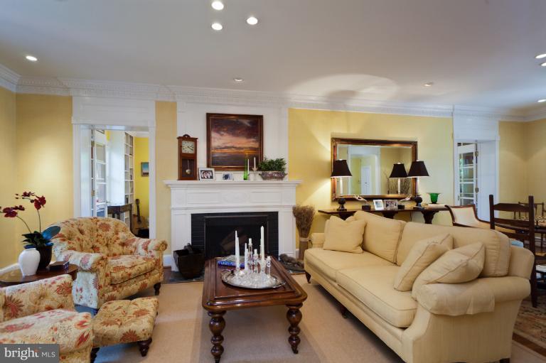 2012 South Arlington Ridge Road Arlington, VA 22202 - Photo 13 of 30 a living room with furniture and a fireplace