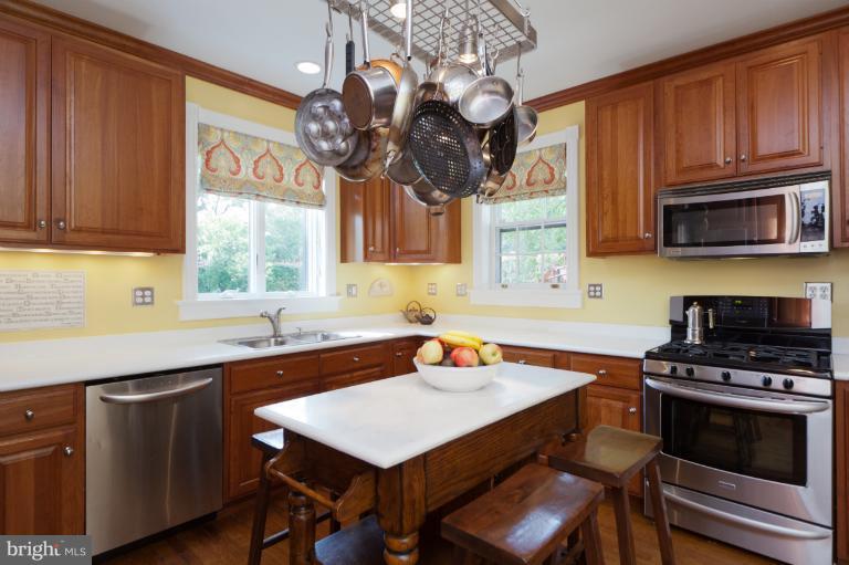 2012 South Arlington Ridge Road Arlington, VA 22202 - Photo 14 of 30 a kitchen with a sink cabinets and appliances
